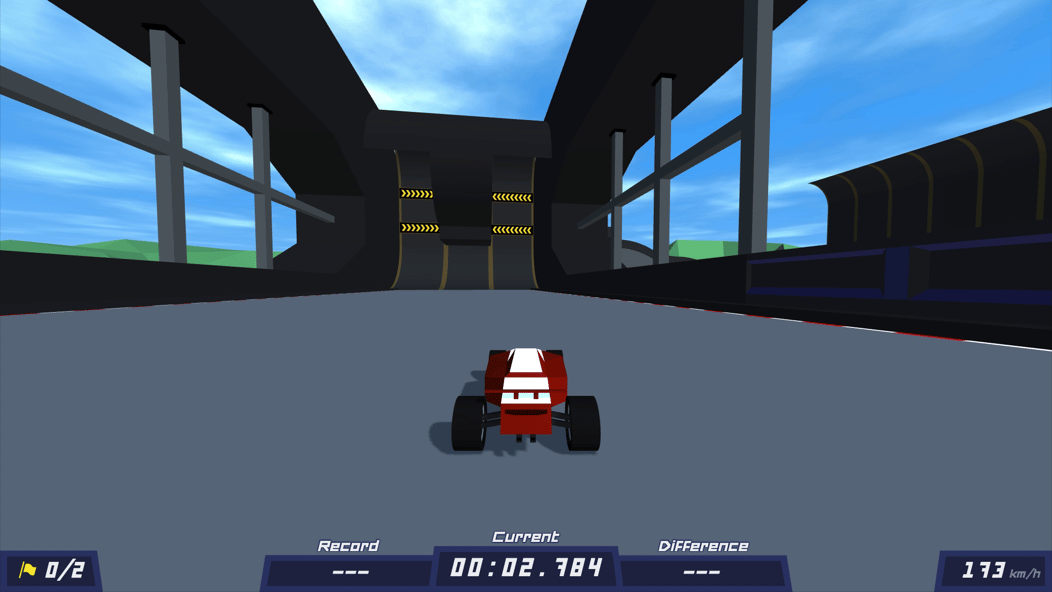 PolyTrack race car driving toward steep ramps inside a dark covered section of the course