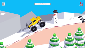 Yellow monster truck driving through a snowy First Gear level in Drive Mad